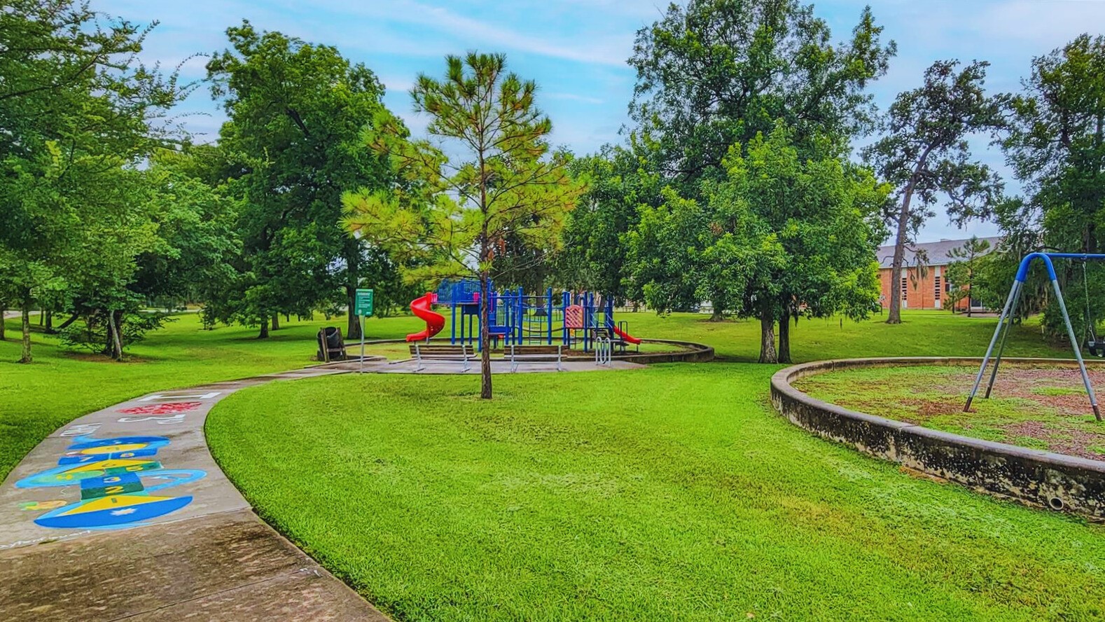 2605 Calumet Street, Unit 34 Houston, TX 77004 - Photo 36 of 37 a view of a park with swings and slides