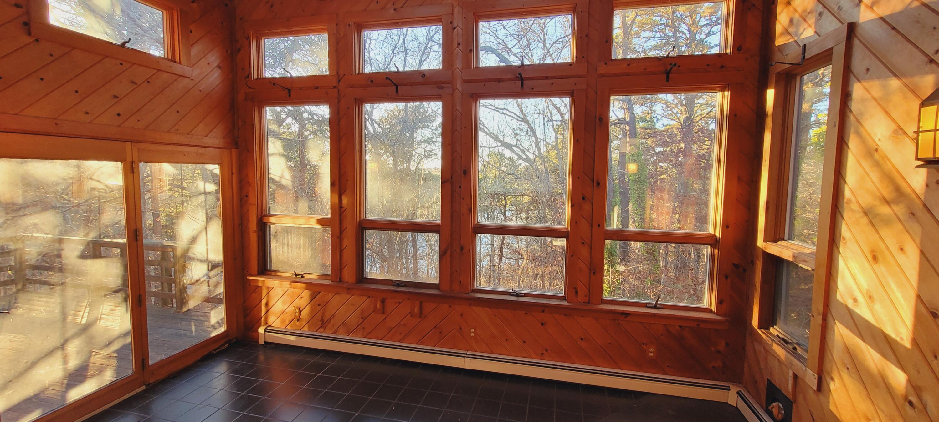 277 Lund Farm Way Brewster, MA 02631 - Photo 11 of 56 a view of an empty room with wooden floor and a window