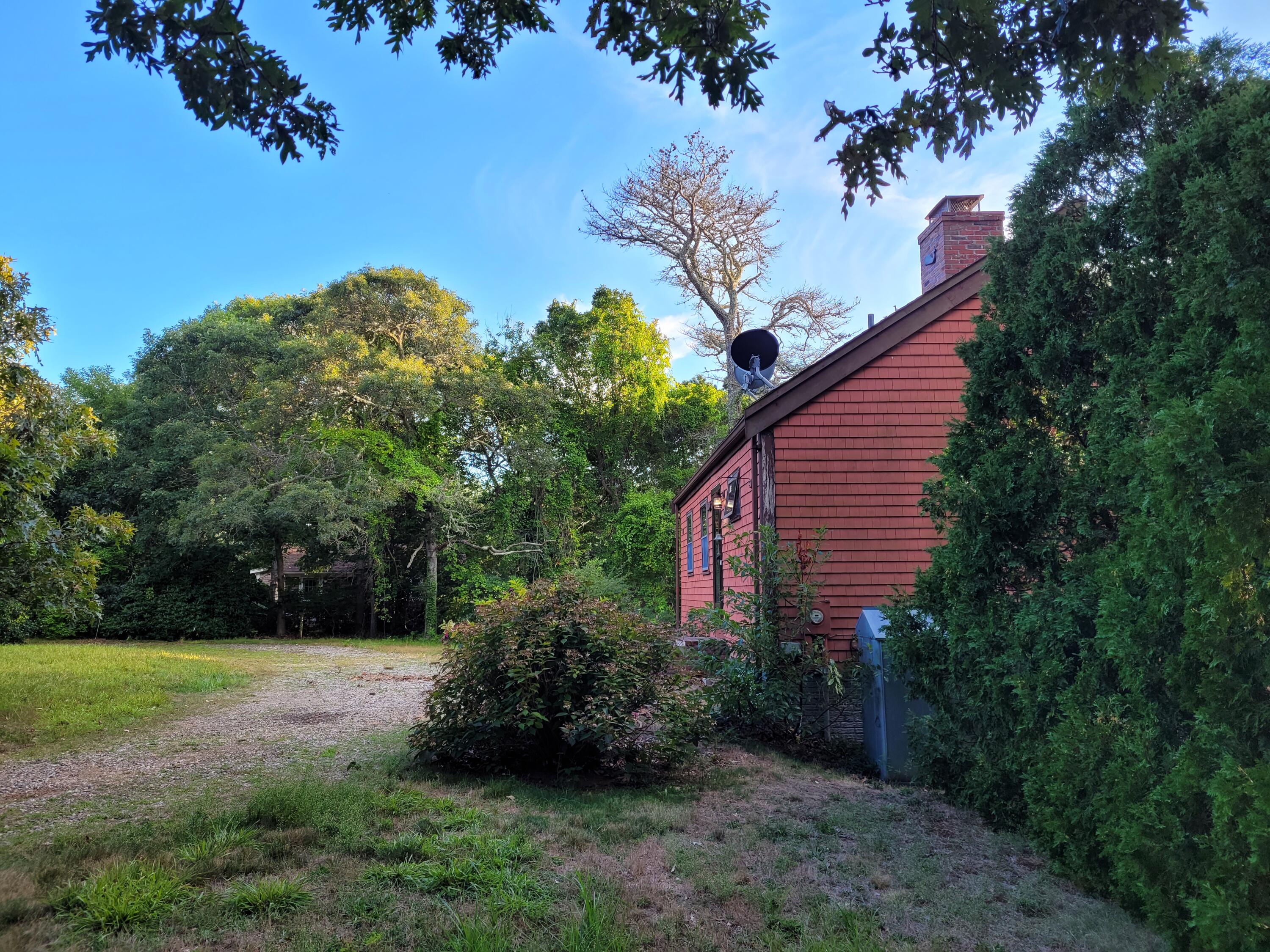 277 Lund Farm Way Brewster, MA 02631 - Photo 17 of 56 a view of backyard with garden and trees