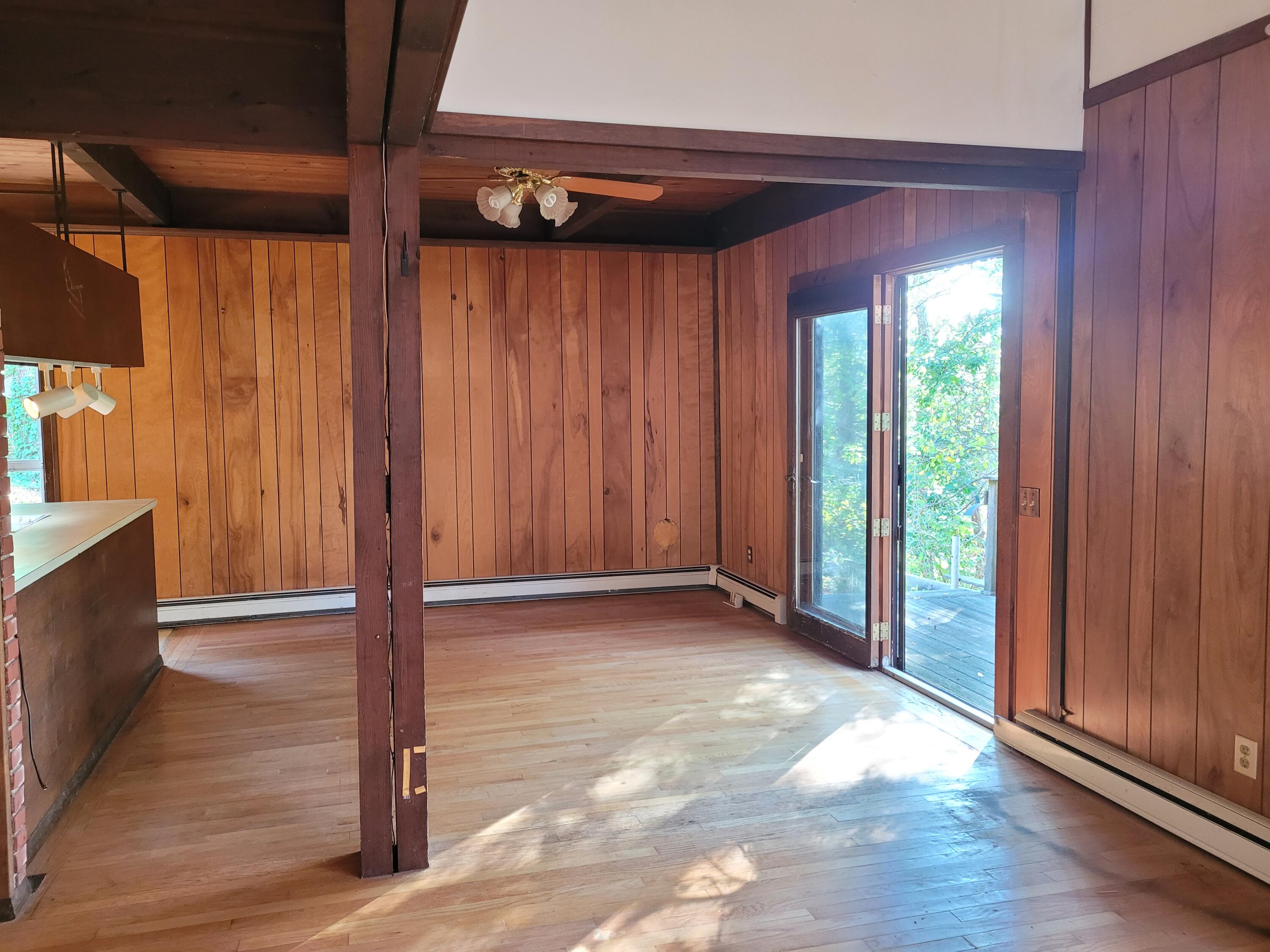 277 Lund Farm Way Brewster, MA 02631 - Photo 28 of 56 a view of an empty room with wooden floor and walls