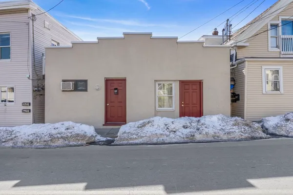 a bedroom with a bed and dresser