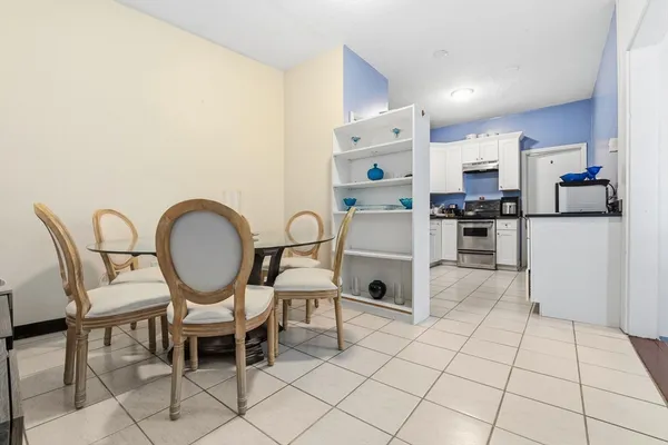 a view of kitchen with dining table and chairs