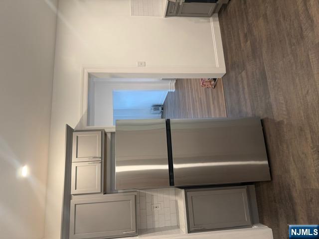 48 Hancox Avenue Nutley, NJ 07110 - Photo 6 of 15 a view of a room with wooden floor and kitchen view