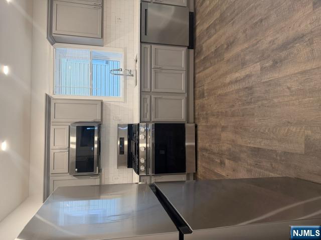48 Hancox Avenue Nutley, NJ 07110 - Photo 8 of 15 a kitchen with a stove and a microwave