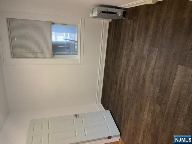 48 Hancox Avenue Nutley, NJ 07110 - Photo 9 of 15 a view of an empty room with wooden floor and a window