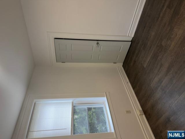 48 Hancox Avenue Nutley, NJ 07110 - Photo 10 of 15 an empty room with wooden floor and windows