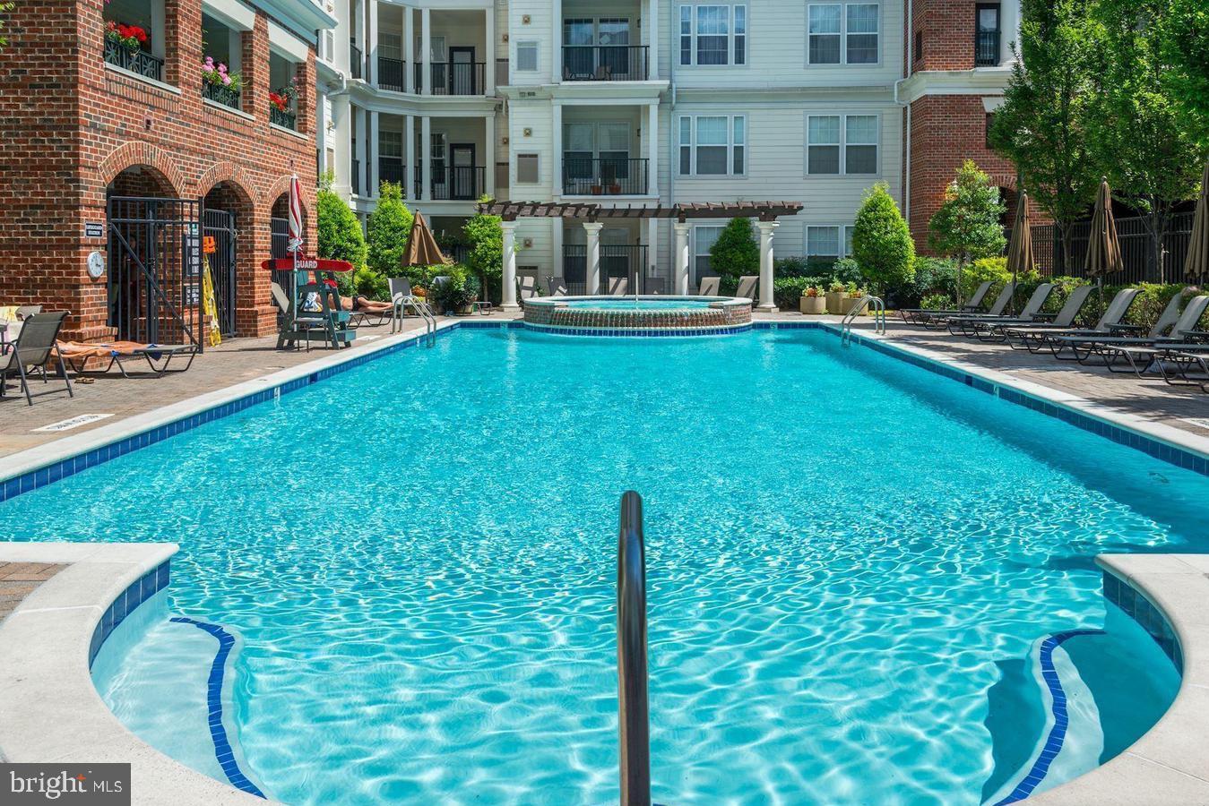 7 Booth Street, Unit 308 Gaithersburg, MD 20878 - Photo 20 of 21 a view of a house with a swimming pool