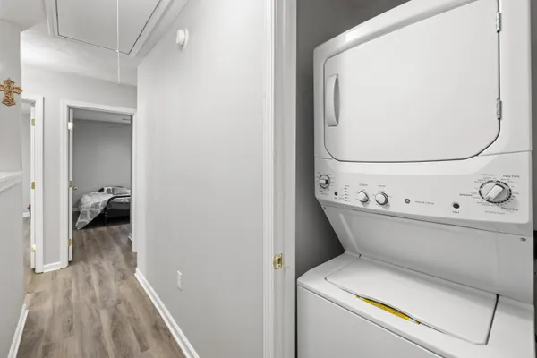 a view of washer and dryer with wooden floor