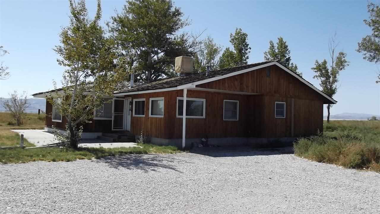 9400 South Allen Road Fallon, NV 89406 - Photo 1 of 1 a front view of a house with a yard and trees