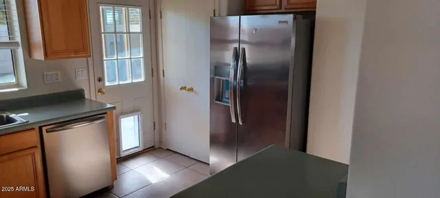 a kitchen with stainless steel appliances granite countertop a sink stove and microwave