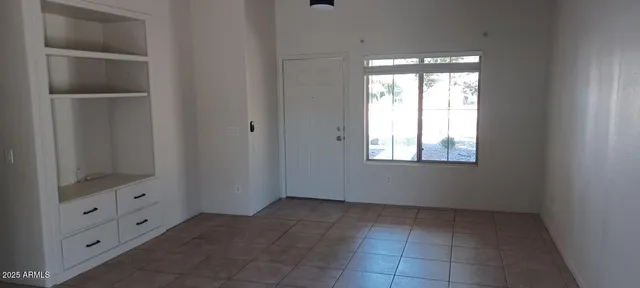 a view of an empty room and window