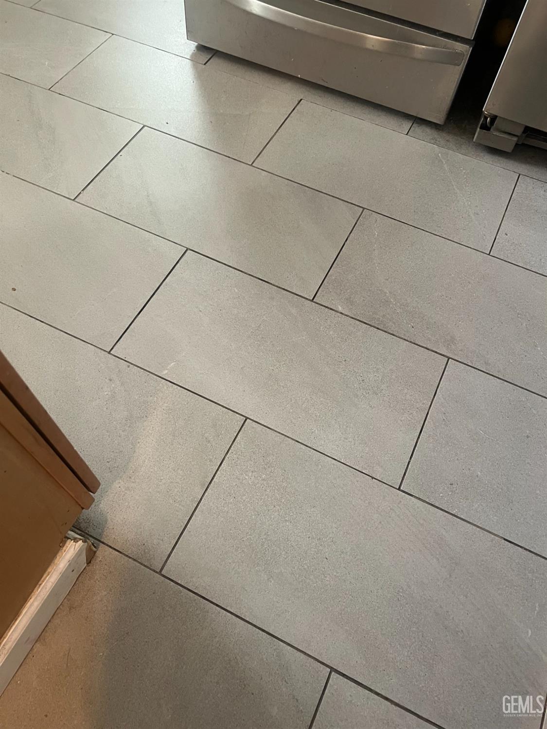 Undisclosed Address Visalia, CA 93291 - Photo 11 of 33 a close view of a refrigerator and a garage