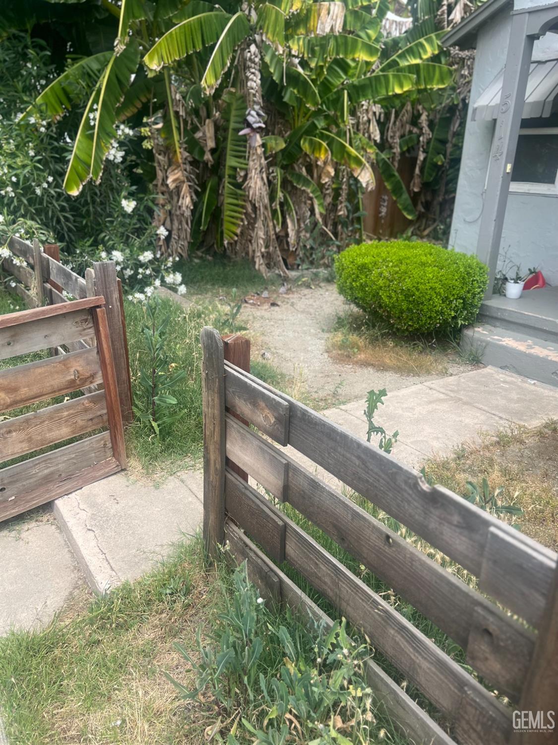 Undisclosed Address Visalia, CA 93291 - Photo 2 of 33 a backyard of a house with lots of green space