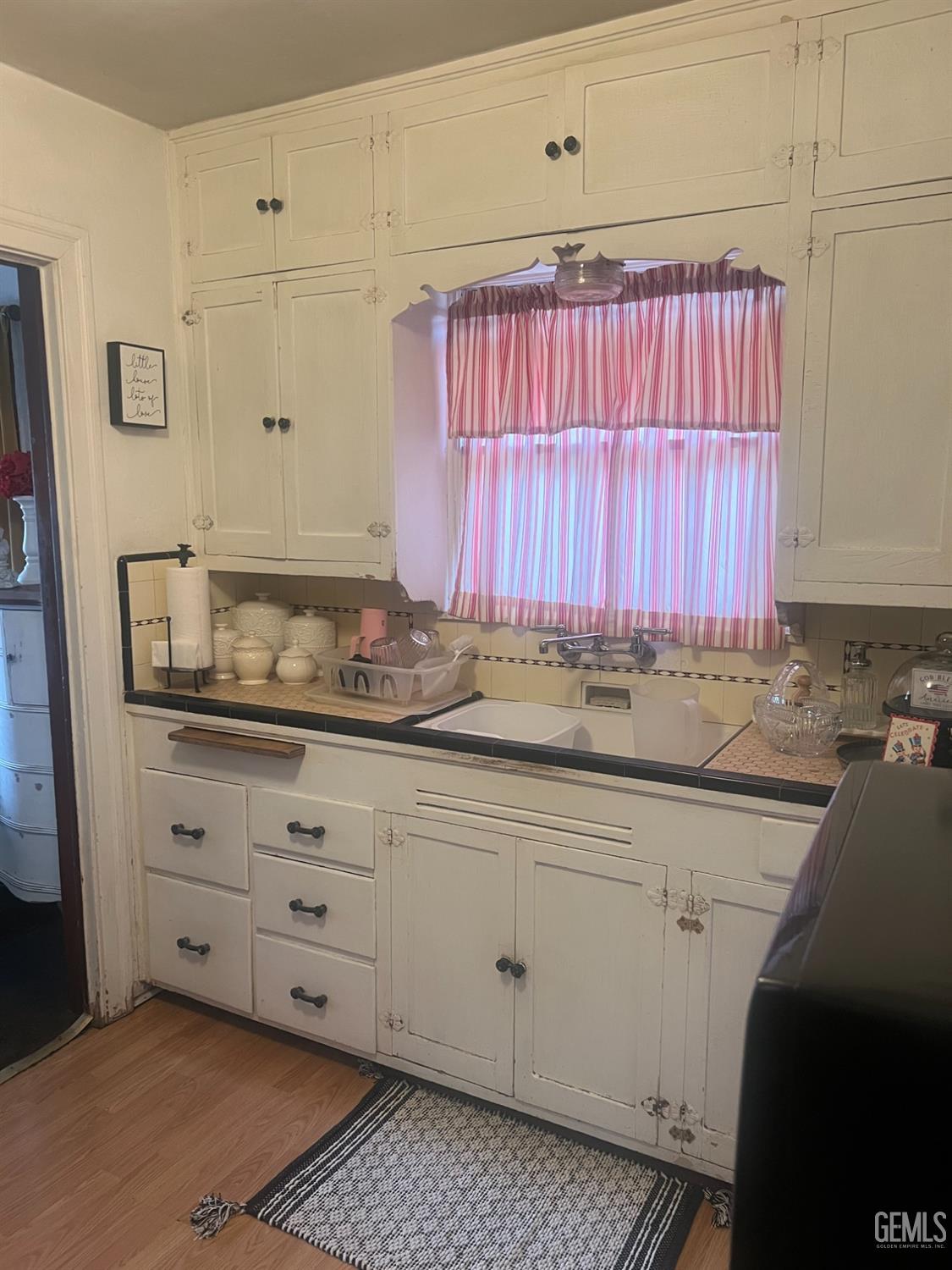 Undisclosed Address Visalia, CA 93291 - Photo 22 of 33 a kitchen with granite countertop white cabinets and sink