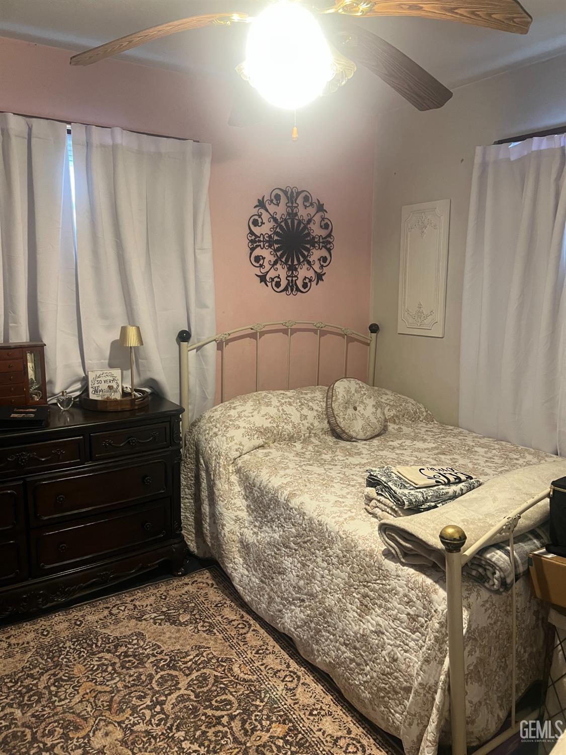 Undisclosed Address Visalia, CA 93291 - Photo 26 of 33 a bedroom with a bed and cabinets