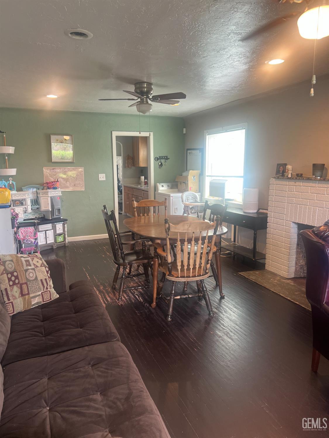 Undisclosed Address Visalia, CA 93291 - Photo 3 of 33 a view of a dining room with furniture window and wooden floor