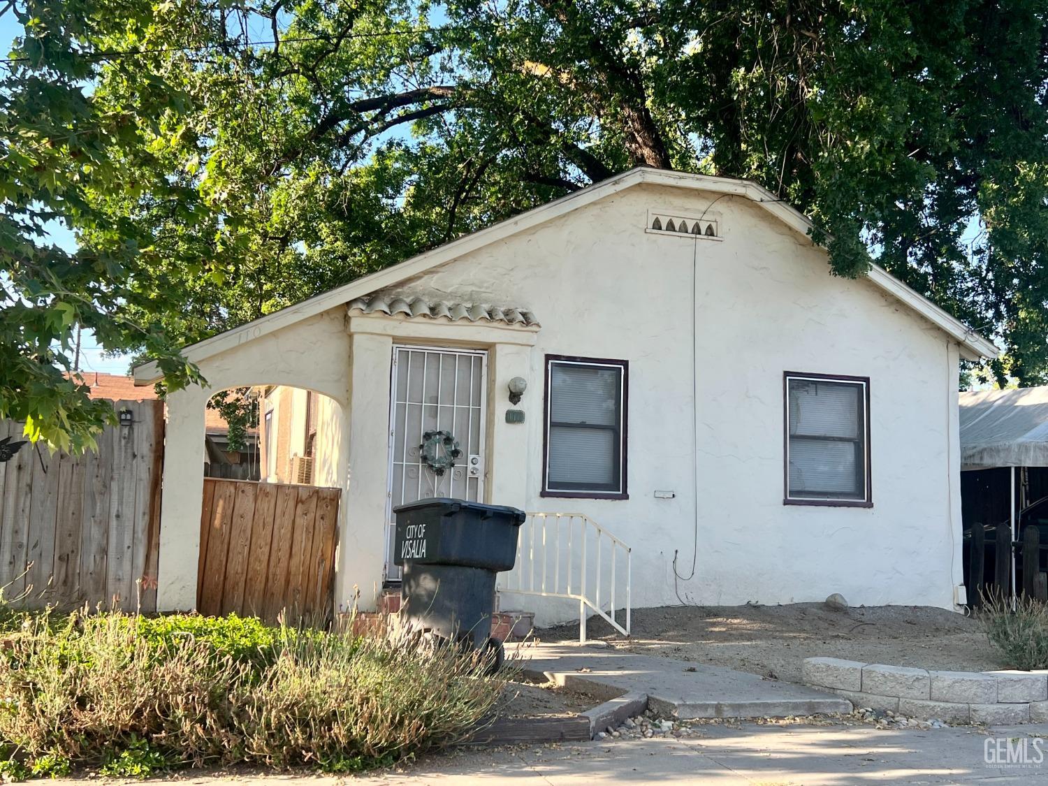 Undisclosed Address Visalia, CA 93291 - Photo 32 of 33 a front view of a house with a yard