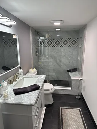 a kitchen with a sink a refrigerator and cabinets