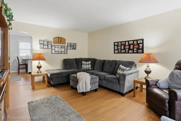 a kitchen with stainless steel appliances granite countertop a refrigerator a sink and a stove