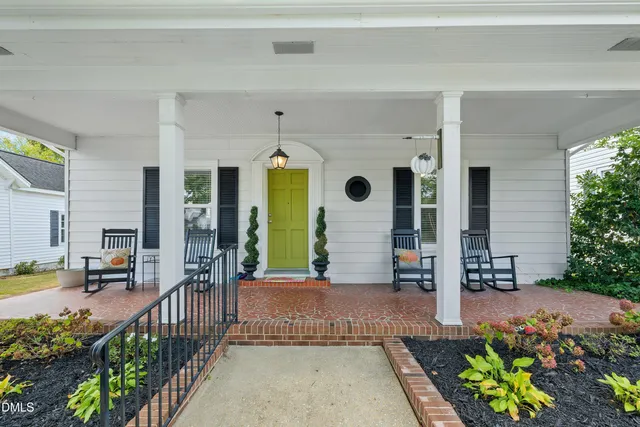 a front view of a house with a porch
