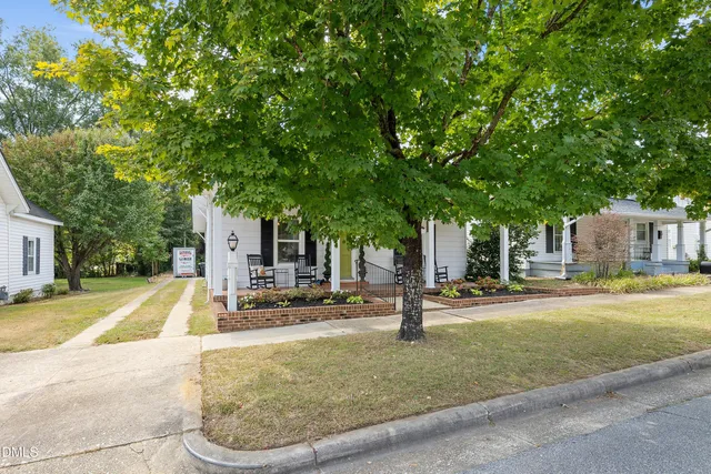 a house with trees in the background