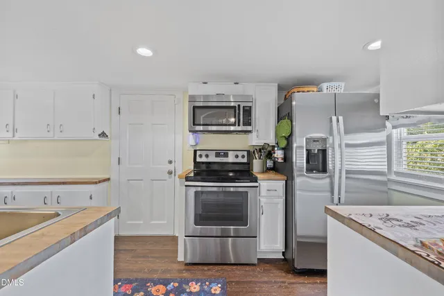 a kitchen with a stove and a refrigerator
