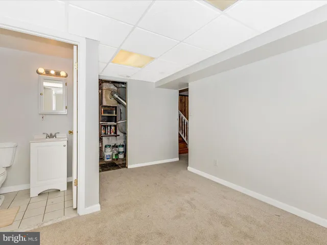a view of a swimming pool with a patio and a yard