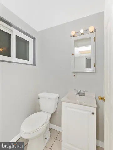 a view of a backyard with plants and tree