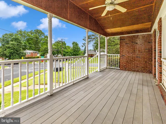 a view of a balcony with wooden floor