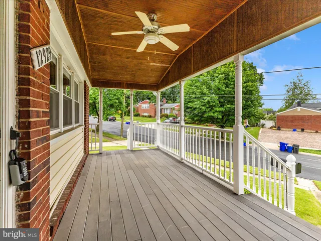 a bathroom with a glass shower door and a window