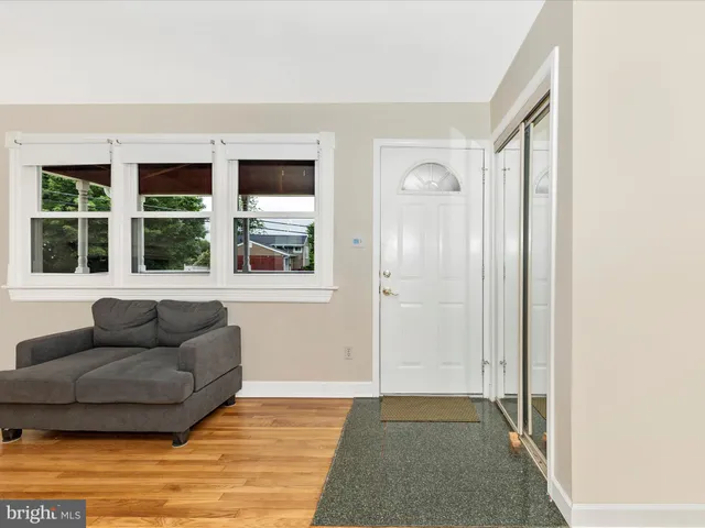 a living room with furniture and windows