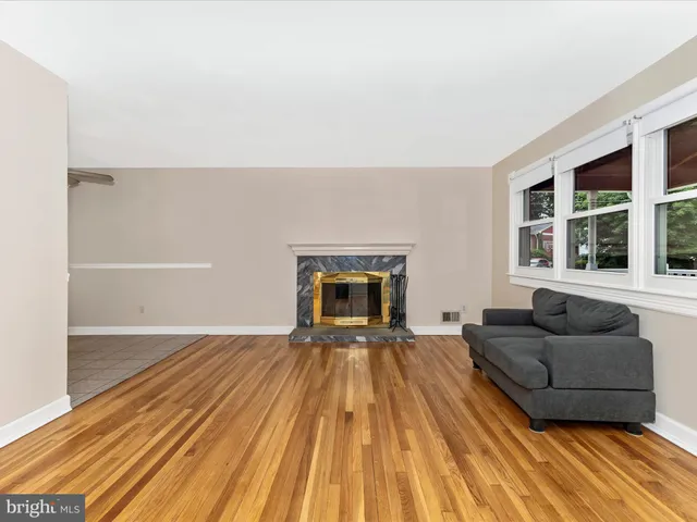 a living room with a couch and a fireplace