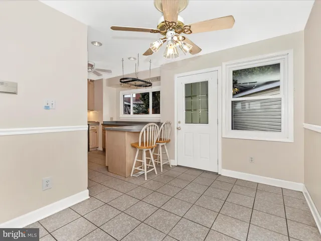 a view of a kitchen with a window and furniture