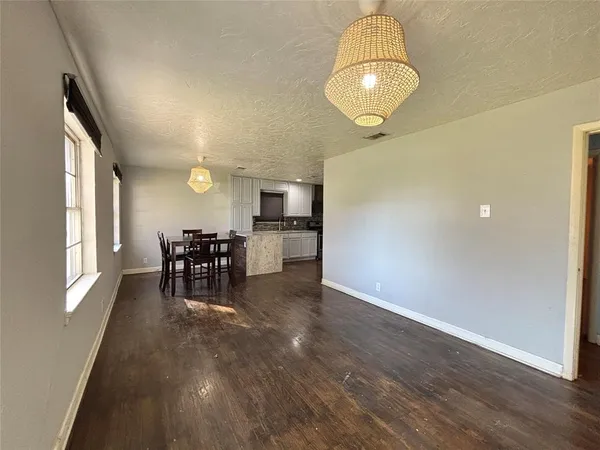 an entryway and livingroom with furniture