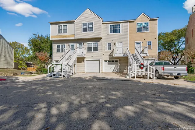 a view of a house with a park