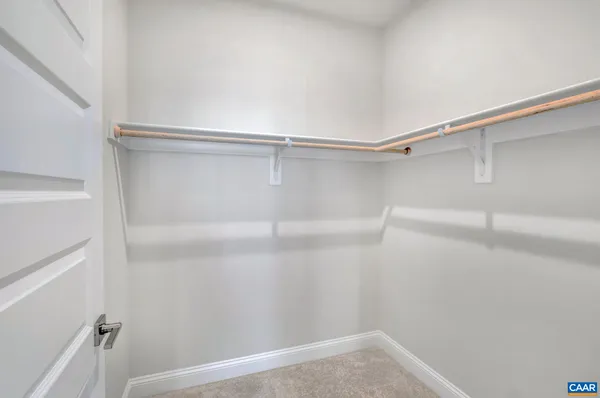 a view of an empty walk in closet