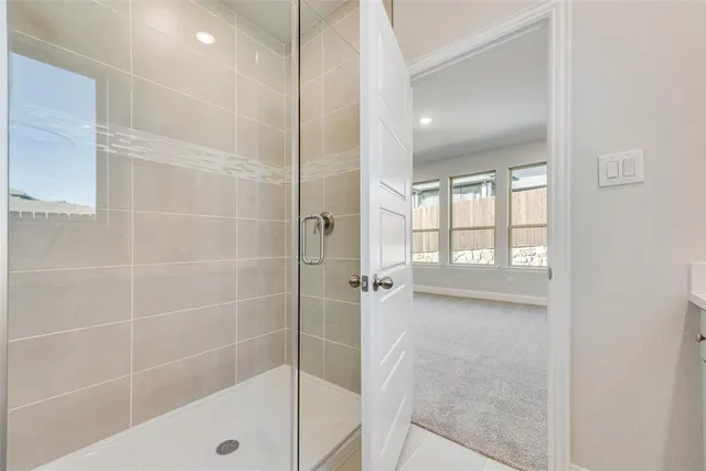 a bathroom with a bathtub and a shower