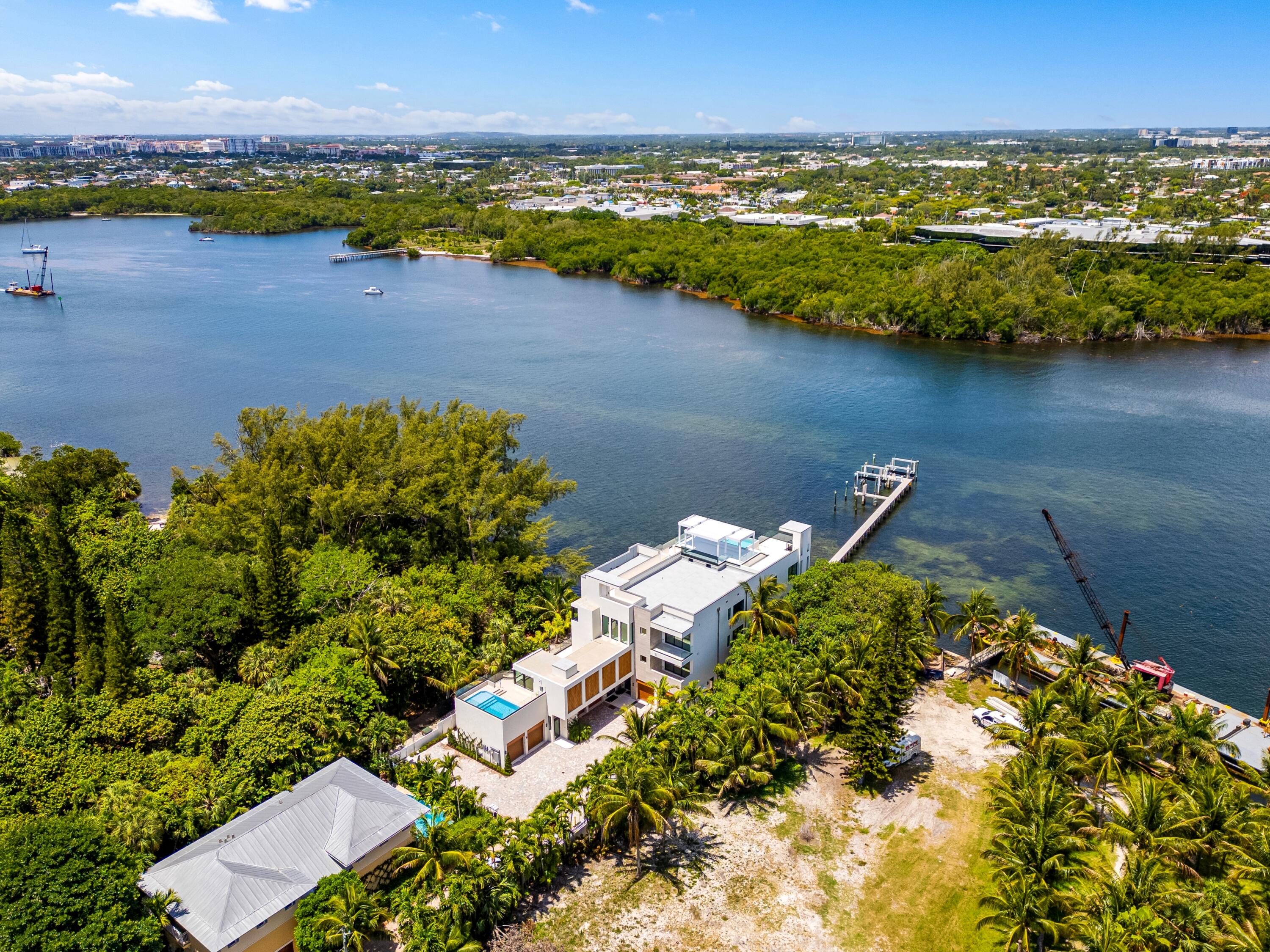 900 Lago Mar Lane, Unit PH Boca Raton, FL 33431 - Photo 50 of 58 an aerial view of a houses with a lake view