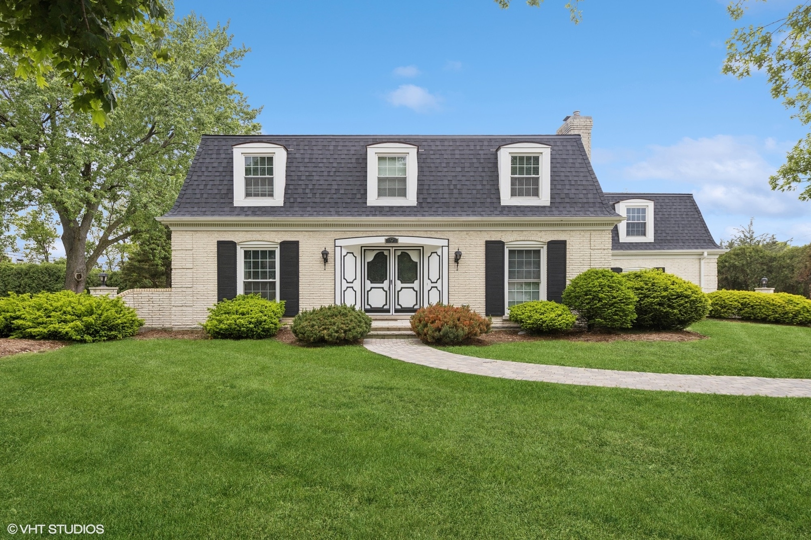 9 Kingston Drive Oak Brook, IL 60523 - Photo 1 of 30 a front view of a house with a yard