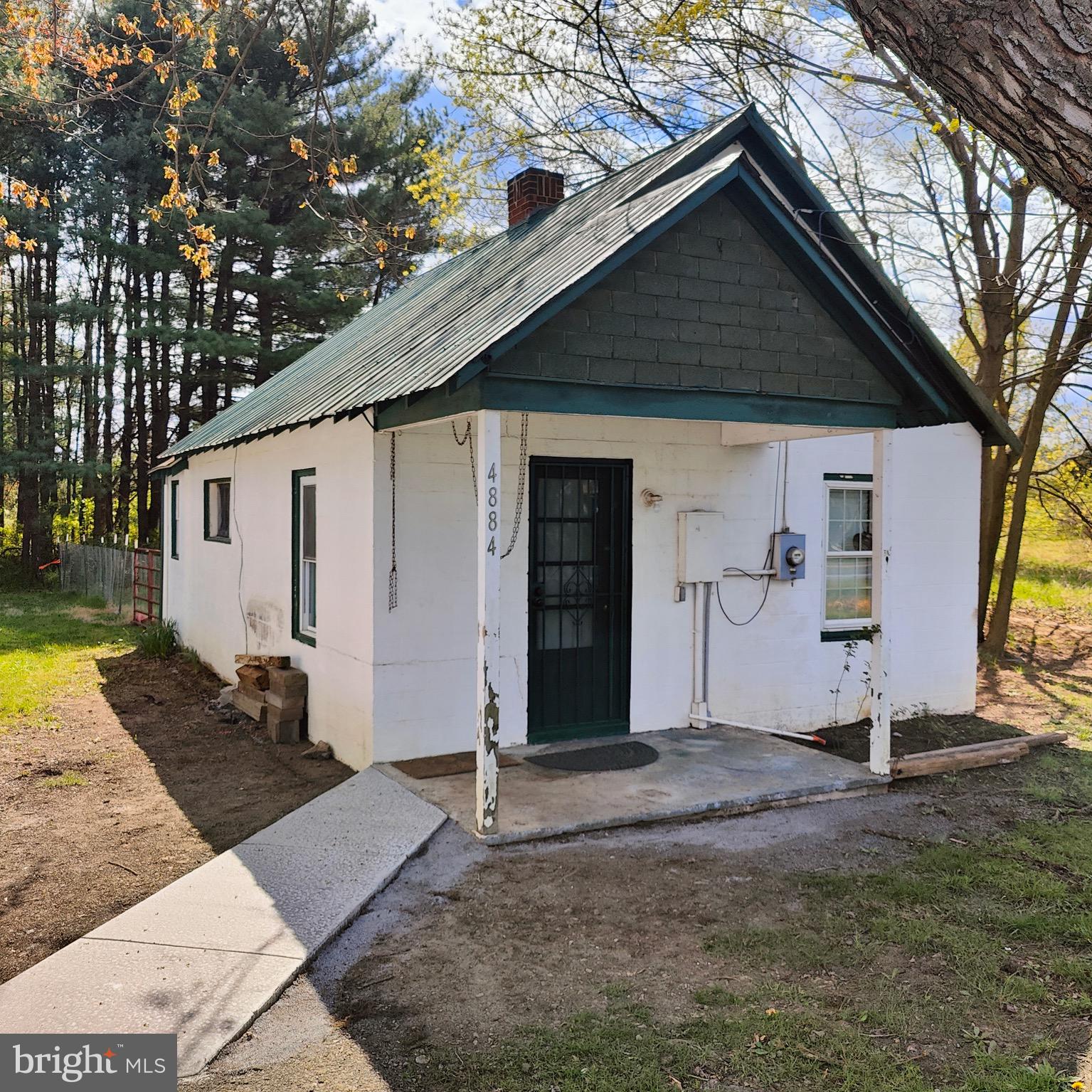 4884 Charles Town Road Kearneysville, WV 25430 - Photo 17 of 22 a front view of a house with garden