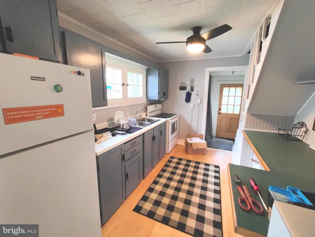 a kitchen with a cabinets and window