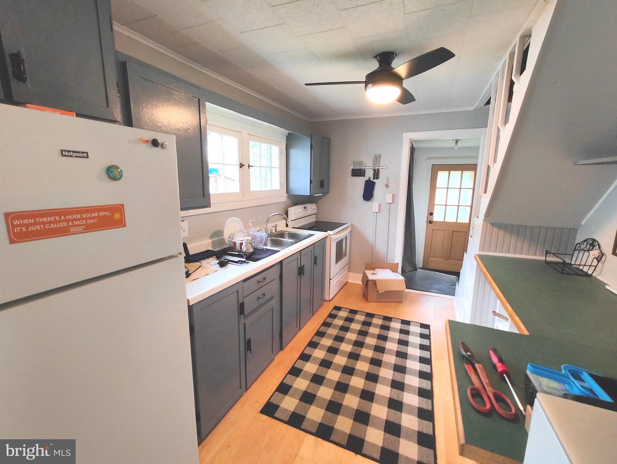 4884 Charles Town Road Kearneysville, WV 25430 - Photo 2 of 22 a kitchen with a cabinets and window