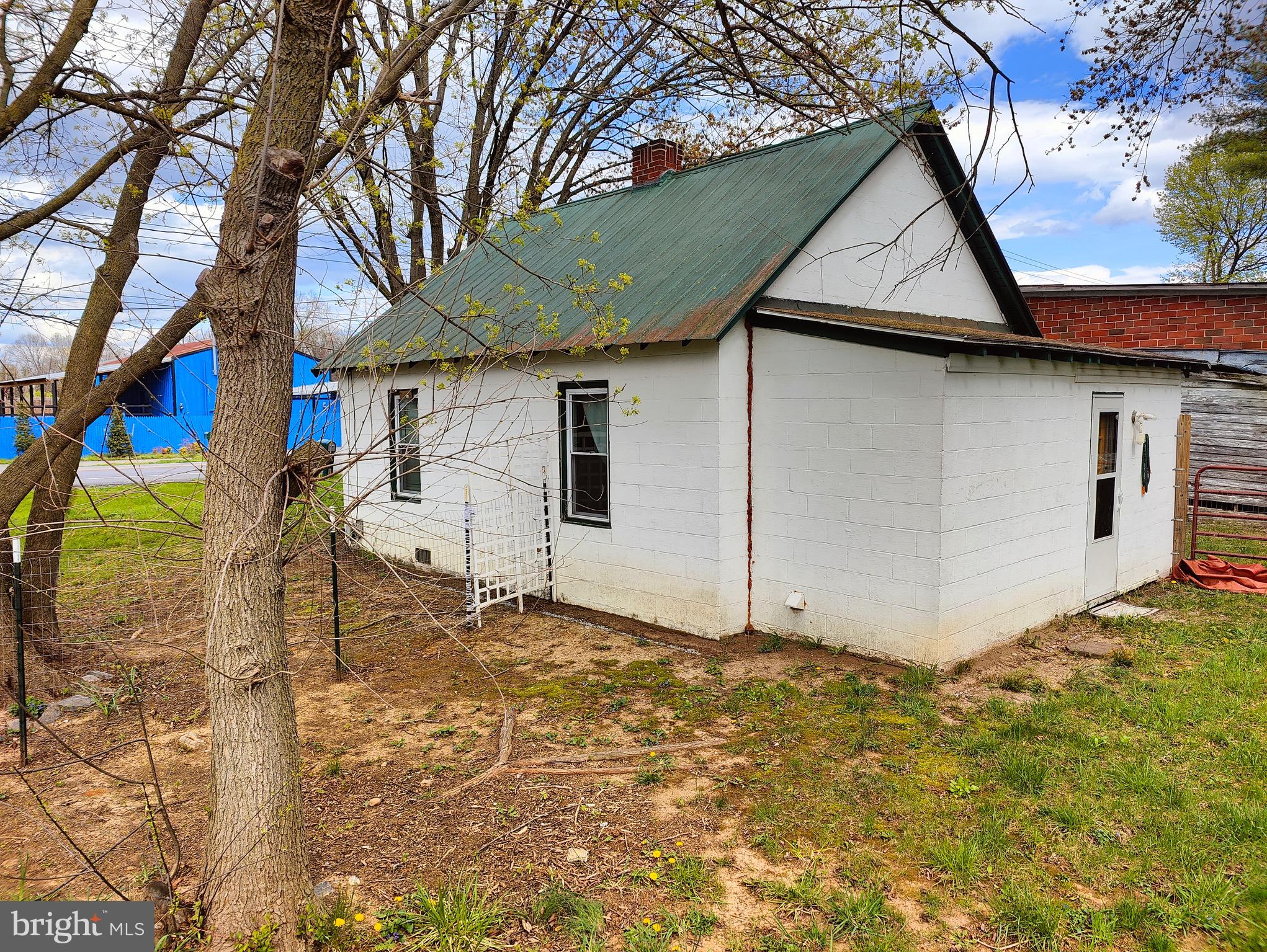 4884 Charles Town Road Kearneysville, WV 25430 - Photo 22 of 22 a white house that has a tree in front of it