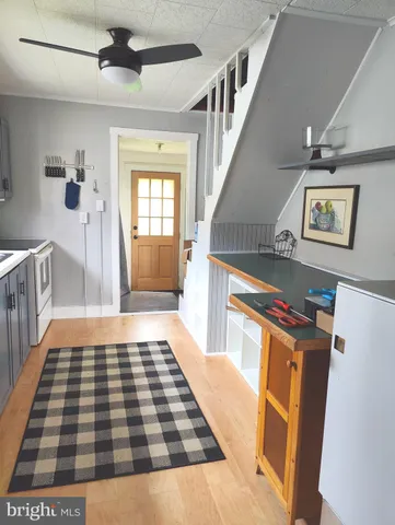 a hallway with black and white cabinets