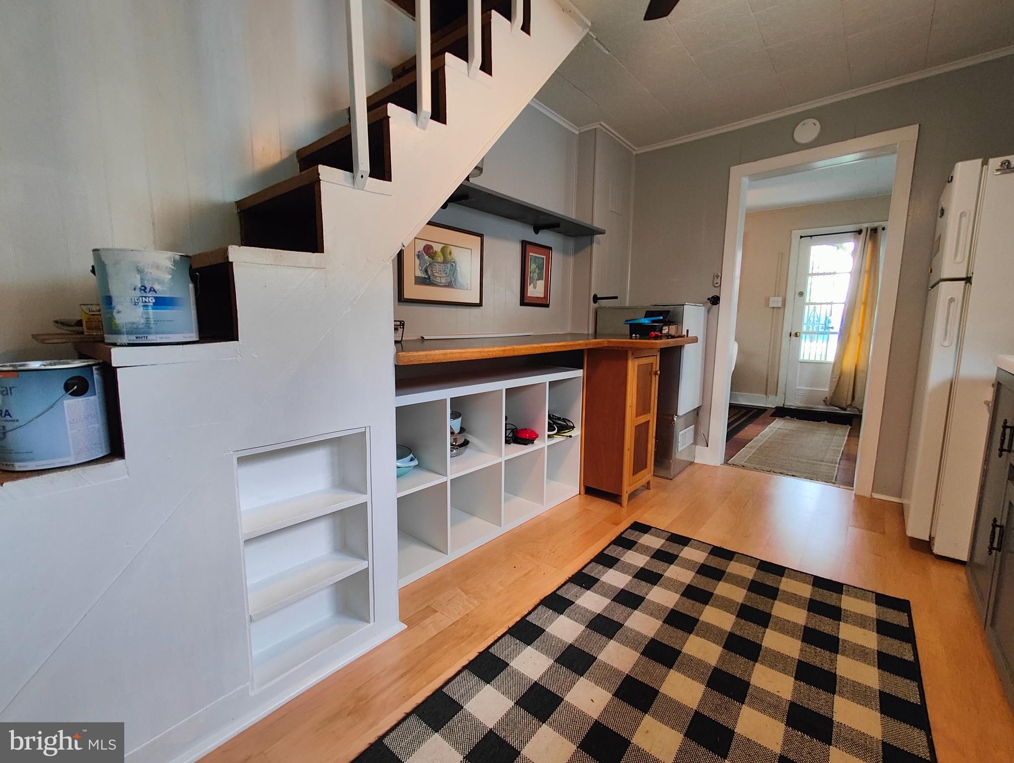 4884 Charles Town Road Kearneysville, WV 25430 - Photo 6 of 22 a walk in closet with wooden floor and windows
