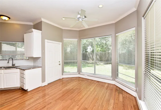 a view of a kitchen with a sink and a window