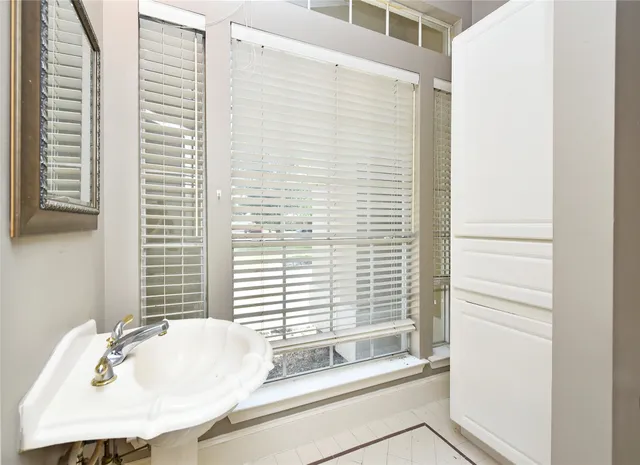 a bathroom with a sink and a bathtub