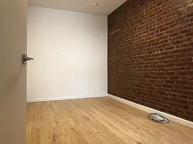 a kitchen with granite countertop a stove and a microwave