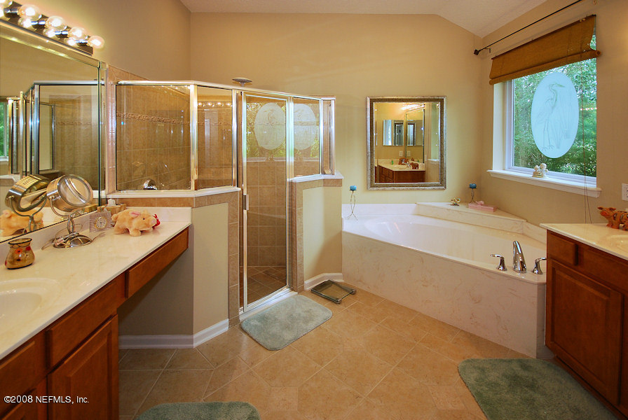 801 Riley Lane St. Augustine, FL 32095 - Photo 11 of 25 a bathroom with a sink and a mirror