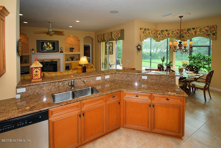 801 Riley Lane St. Augustine, FL 32095 - Photo 8 of 25 a open kitchen with stainless steel appliances granite countertop a stove and a sink
